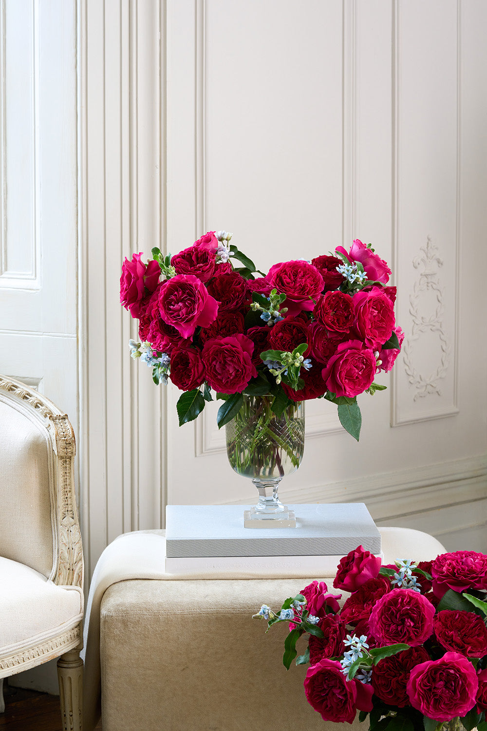 Berry Reds Rose Bouquet Arrangement in Vase sat on Book