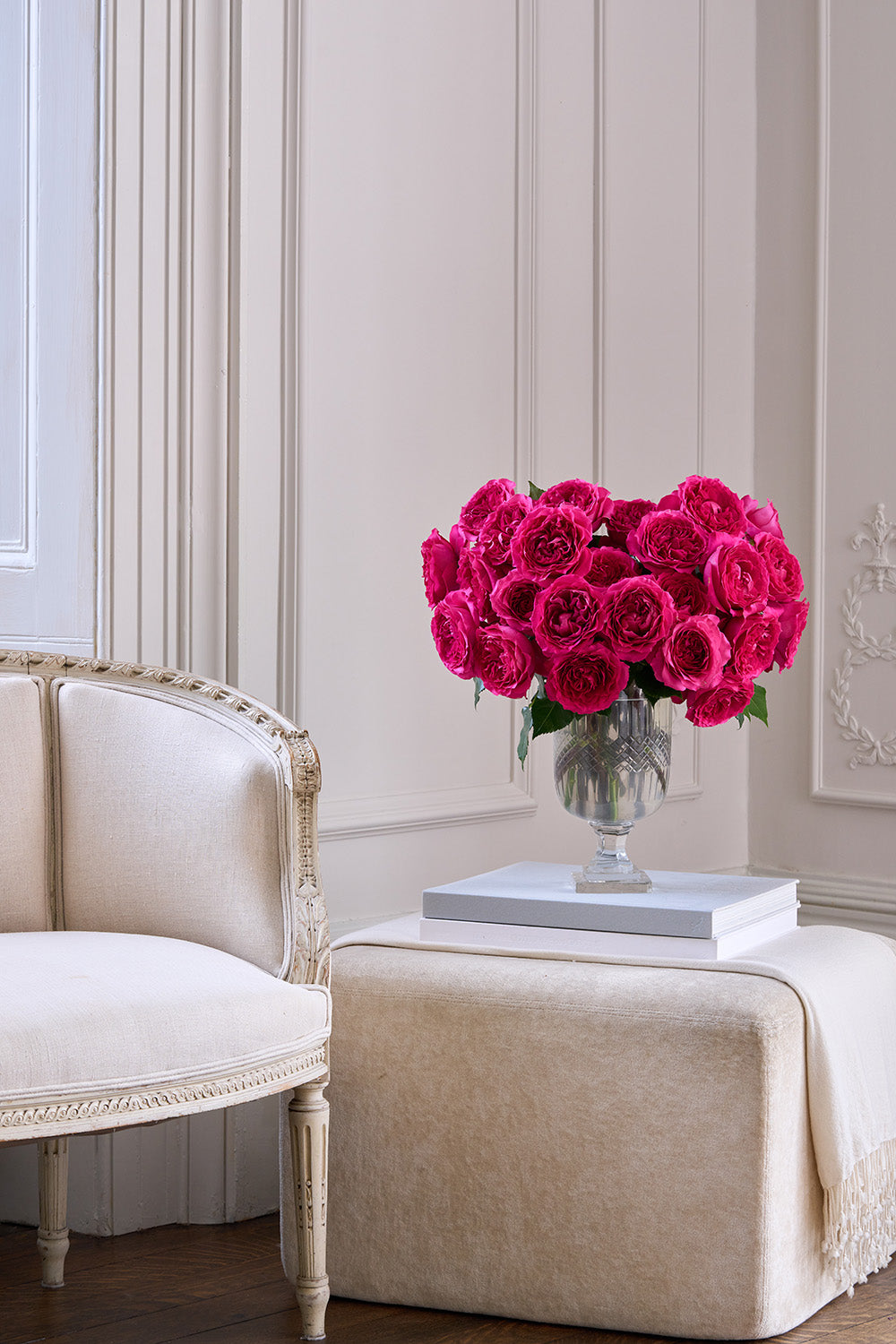 Hettie Rose Bouquet in Large Vase sat on Book in Lounge