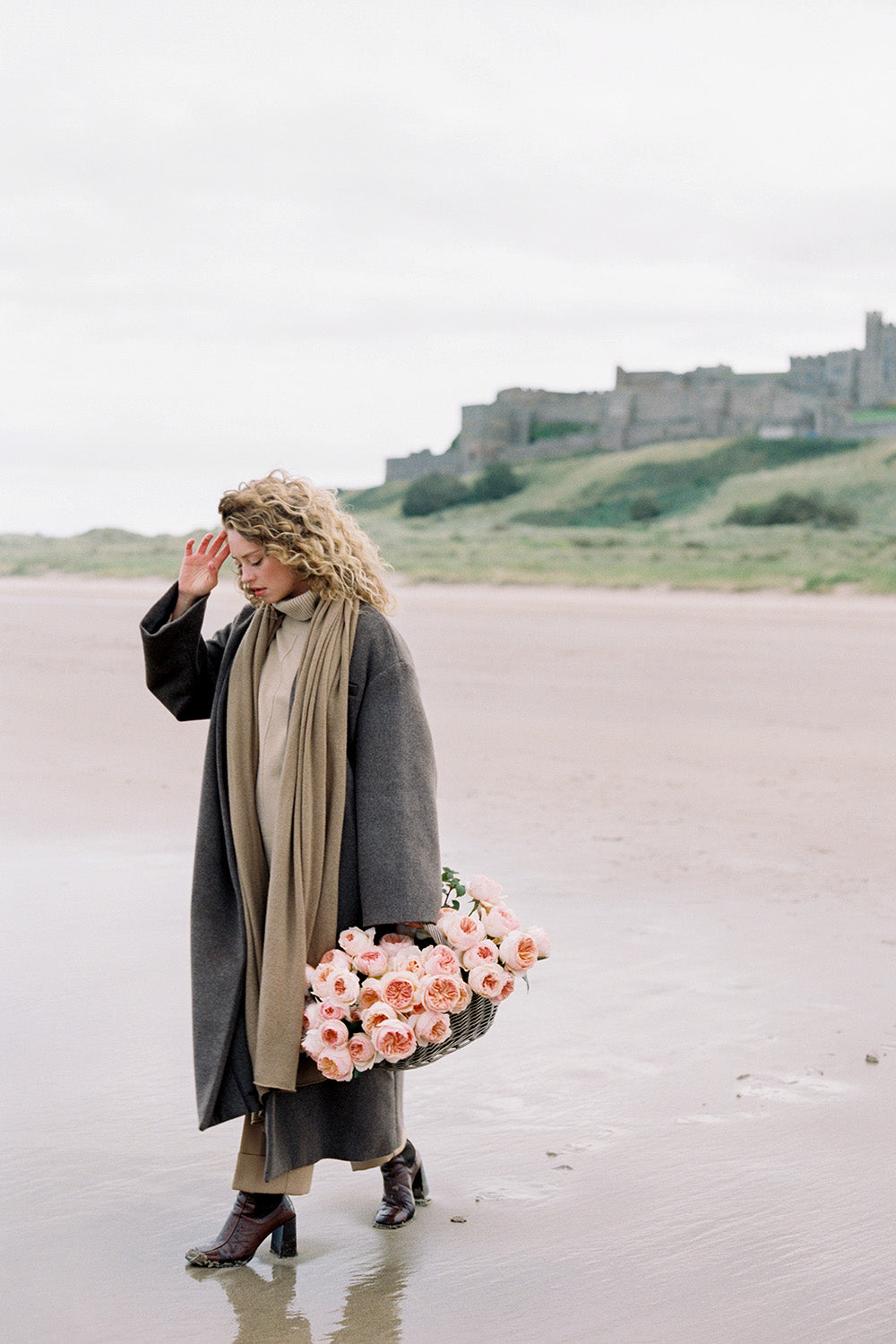 Juliet Muse Walking on Beach With Basket of Roses