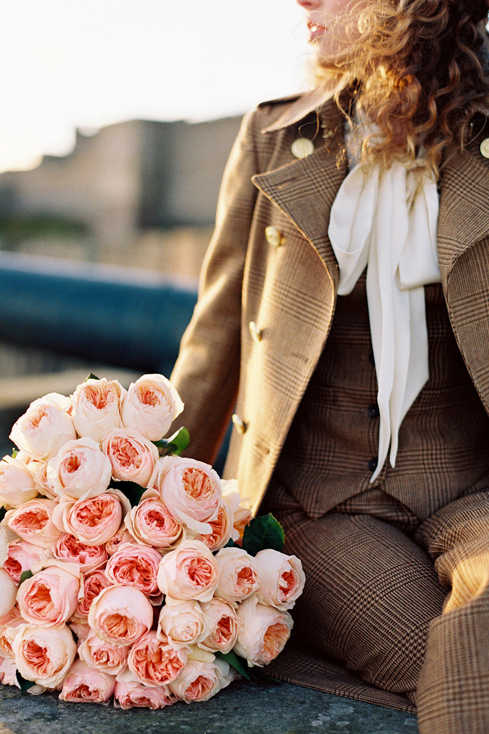 Juliet Muse Sat on Wall with Oversized Bouquet