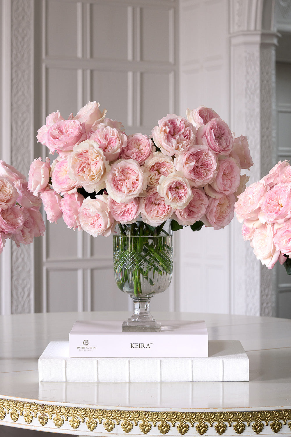 Keira Rose 32 Stems in Vase Sat on Book