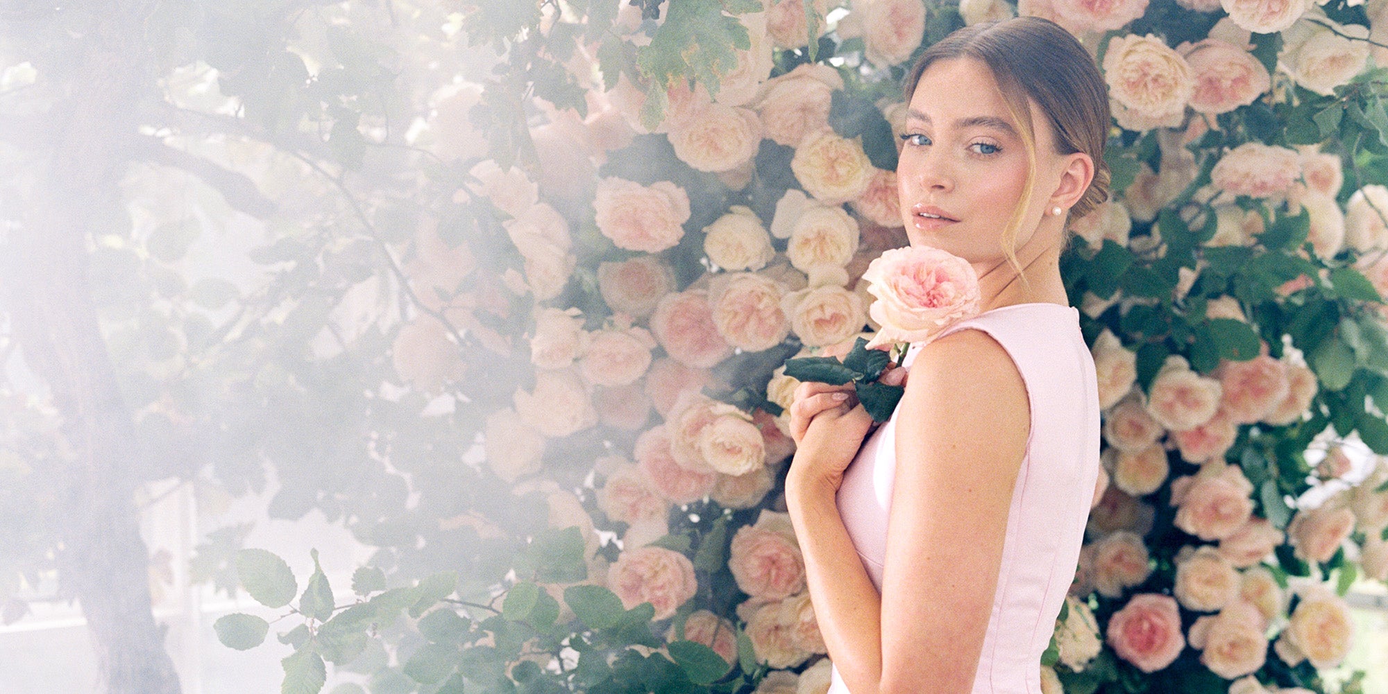 Keira Rose Muse Holding Single Rose Bloom