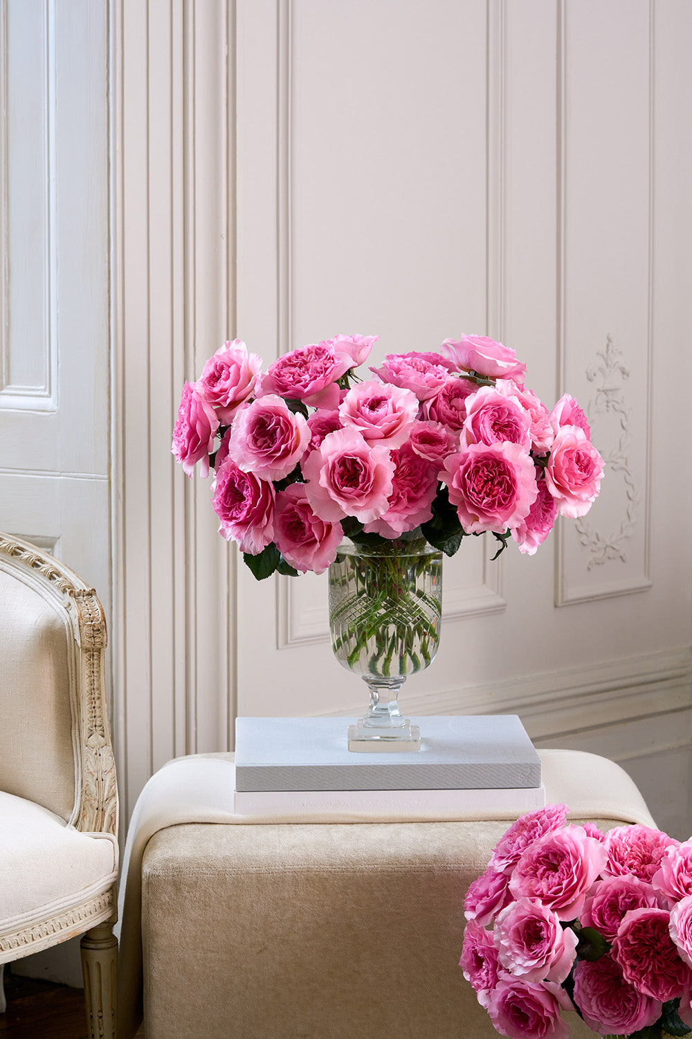 Millicent 32 Stems in Vase Sat on Book