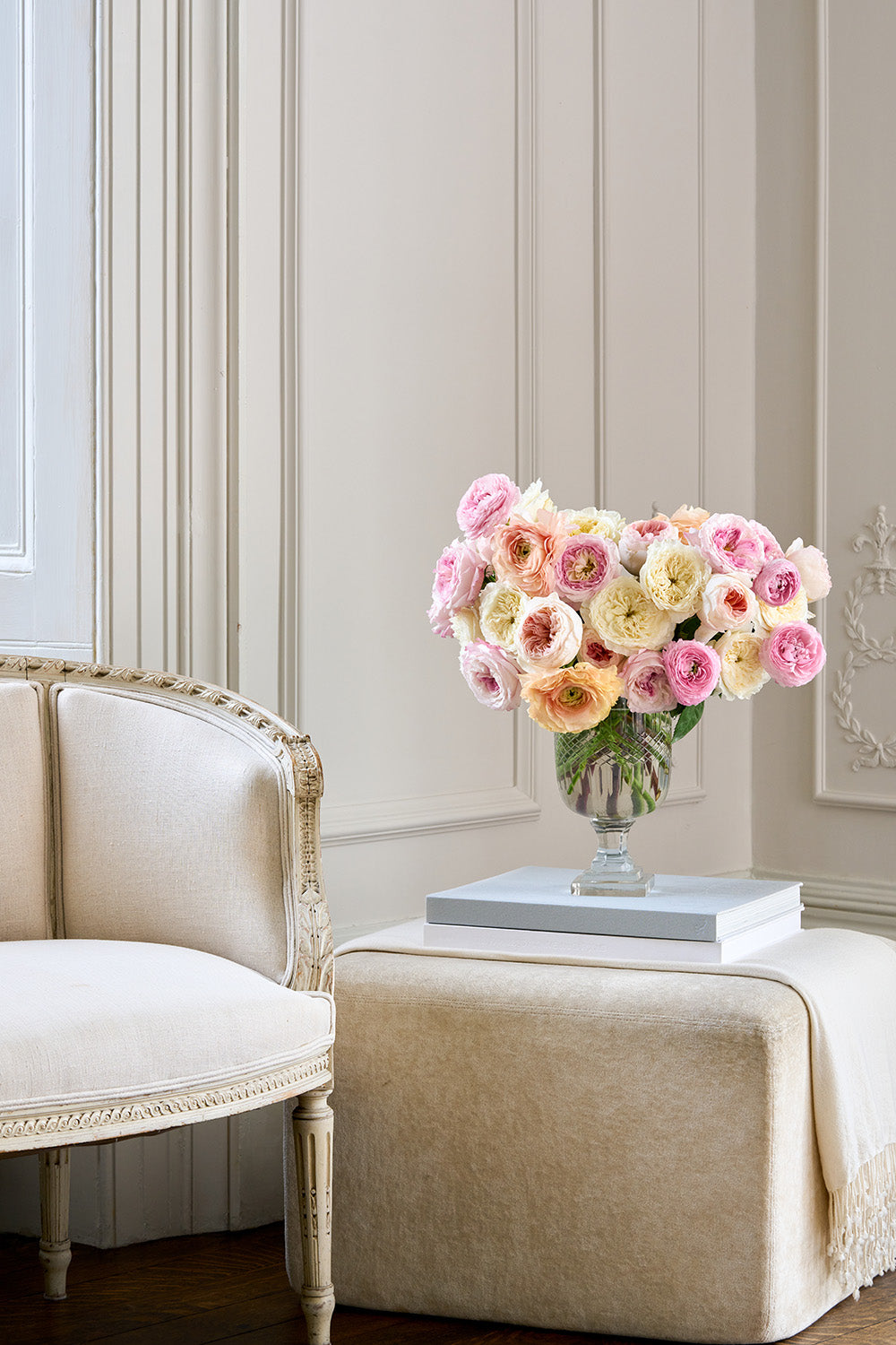 Pastel Chenille Rose Bouquet Arrangement in Vase sat on book