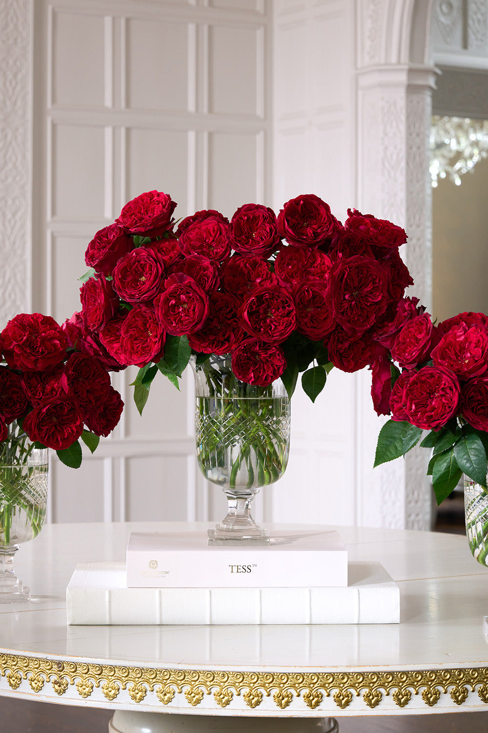 Tess Rose 32 Stems in Vase Sat on Books