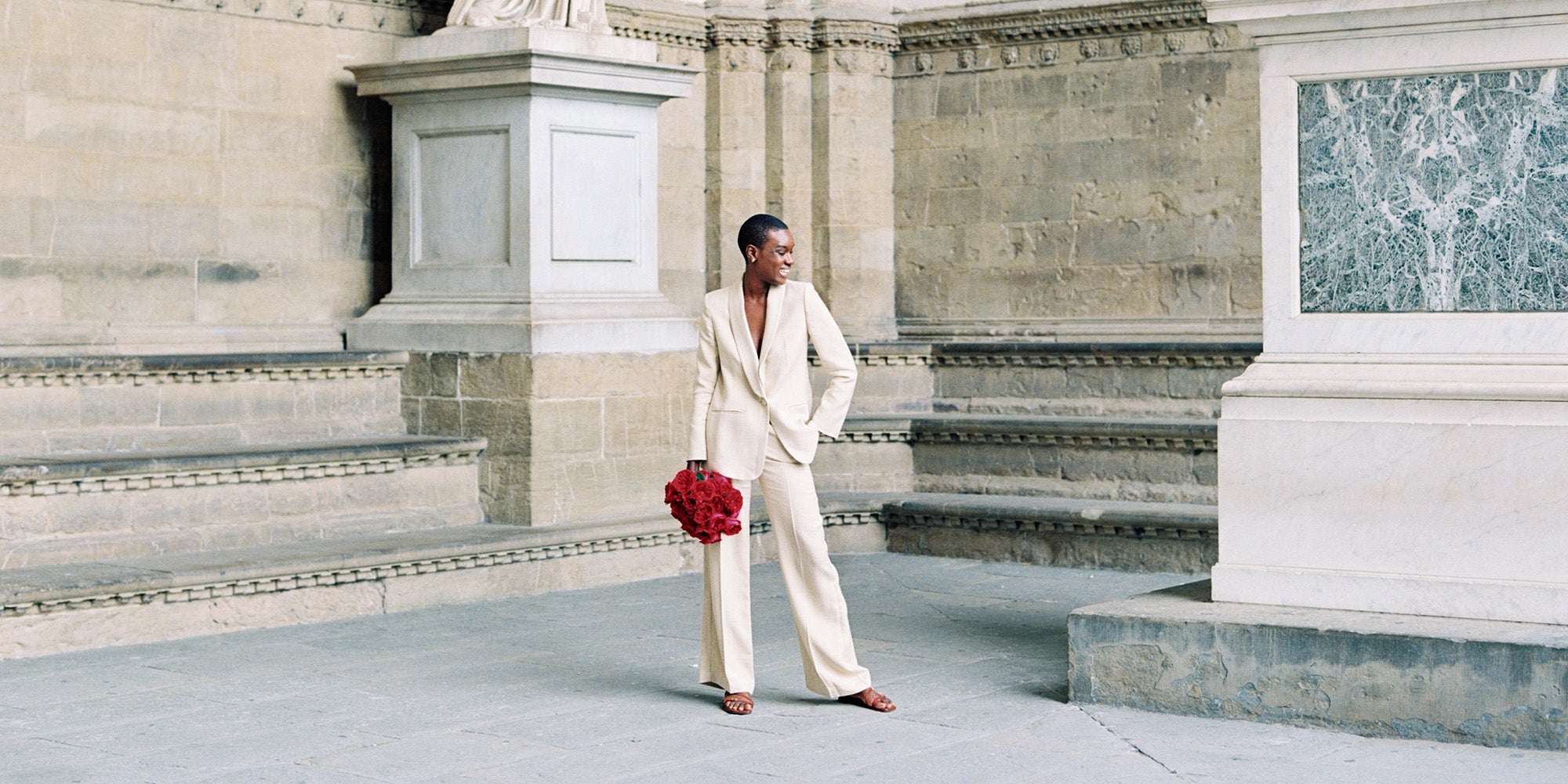 Tess Rose Muse Holding Bouquet in Cream Suit