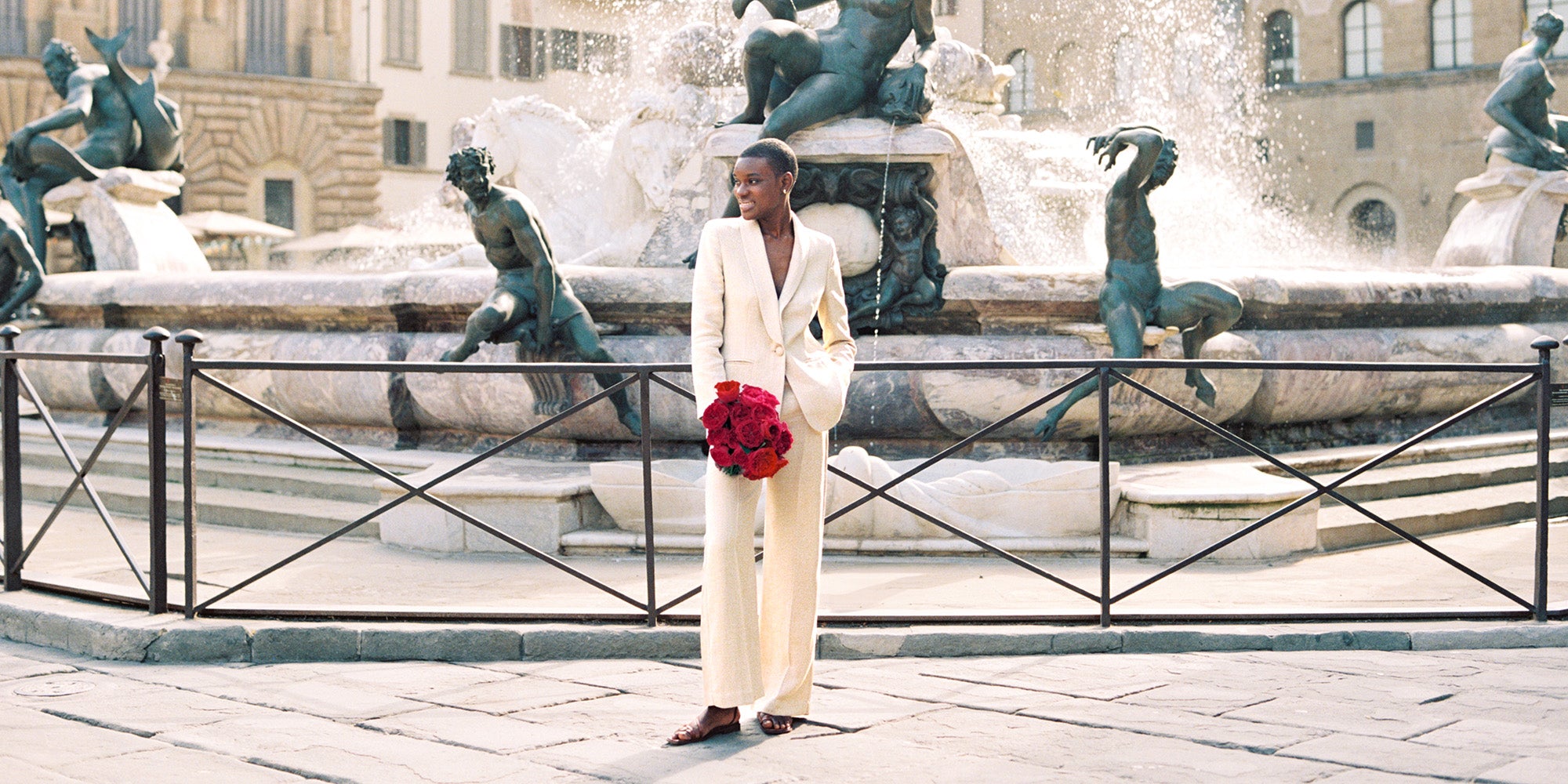 Tess Rose Muse Holding Bouquet in Cream Suit